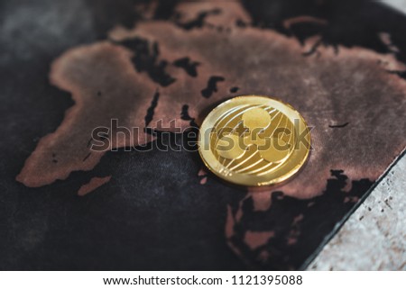 Gold Ripple XRP Coin Token on World Map in Asia