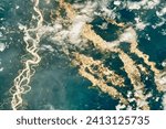 Gold Rush in the Peruvian Amazon. Gold mining pits line the rivers and cut into the rainforest. Elements of this image furnished by NASA.