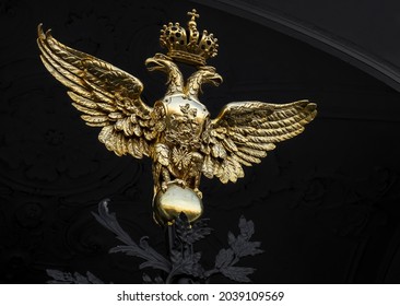 gold russian double-headed eagle on Hermitage gates. Golden double-headed eagle on the ceremonial front gate of the Winter Palace in Saint Petersburg city center, Russia. Culture, national landmark