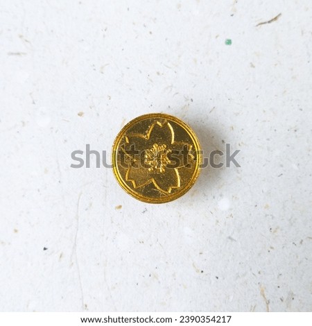 Gold sakura pattern wax stamp or wax seal head on a white background. Can be use to make wax coins for vintage antique wedding invitation or decoration. Top view, flat lay, isolated on white