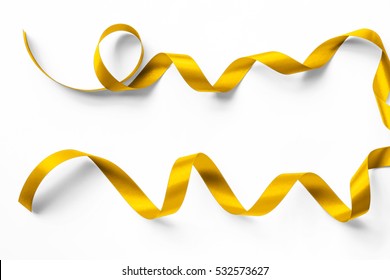 Gold Satin Ribbon Metallic Bright Yellow Golden Brilliant Curly Bow Color Isolated On White Background With Clipping Path For Holiday Greeting And Party Invitation Card Design Decoration Element