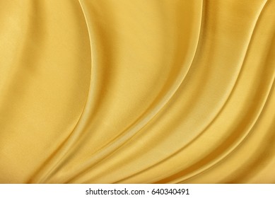 Gold Silk Texture Of Satin Abstract Background.