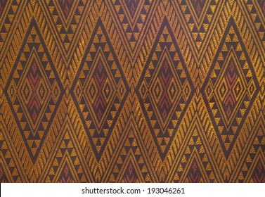 Gold silk thai fabric pattern background