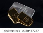 Gold and silver bars of different weight isolated on black  background.