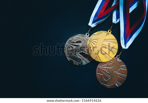 Gold, silver and Bronze medal, black background.\
Summer game, Tokyo 2020