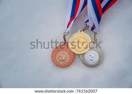 Gold silver and bronze medal on the snow background. Winter sport trophy, Winter game in South Korea,