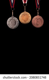 Gold, Silver And Bronze Medals  With Numbers On Black Isolated Background For Winners. Medal With Tricolor Ribbon .Winter Olympic Games In  Beijing 2022, Useful For Banner,background