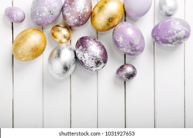 Gold and silver Easter eggs. Holiday background
