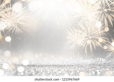 Gold and silver Fireworks and bokeh in New Year eve and copy space. Abstract background holiday.