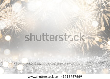 Gold and silver Fireworks and bokeh in New Year eve and copy space. Abstract background holiday.