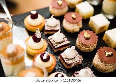 Gold and Silver Foiled Wedding Desserts and Mousses - Shutterstock ID 1131133466