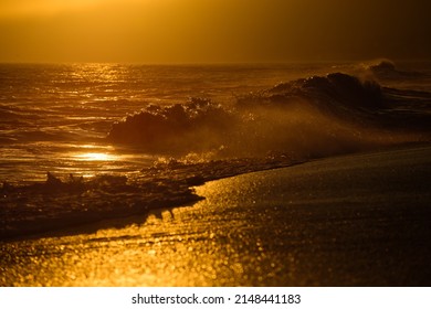 Gold Sky And Ocean Water. Waves Splashes. Sunset Over Sea With Golden Dramatic Sky Panorama. Calm Sea With Sunset Sky. Ocean And Sky Background.