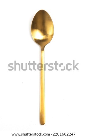 gold spoon isolated on white background. top view 
