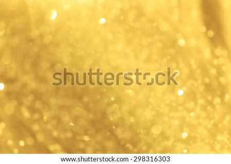 Gold spring or summer background. Elegant abstract background with bokeh defocused lights