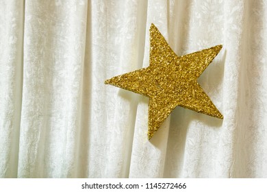 Gold Star On White Fabric