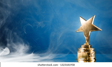 Gold Star Trophy In Smoke, Blue Background