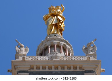 Gold statue of Mary and child front view on top of the basilica Notre-Dame de la Garde at Marseilles in south of France. Department Bouches-du-Rhône, region Provence-Alpes-Côte d'Azur