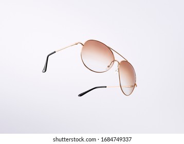 Gold Sunglasses Isolated On A White Background