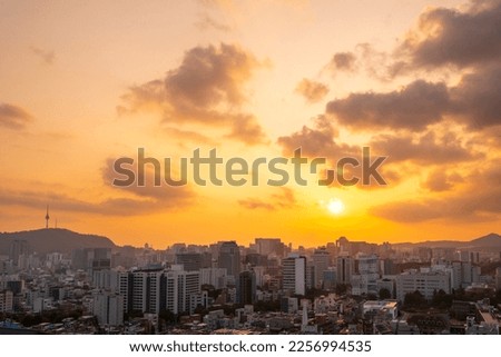 Gold sunset of Seoul cityscapes with high rise office buildings and skyscrapers in Seoul city, Republic of Korea in winter blue sky and cloud