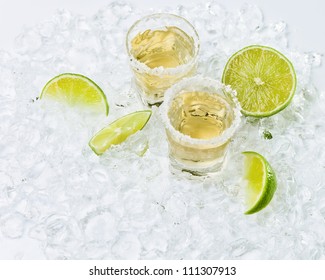 Gold Tequila With Salt And Lime On A Ice.