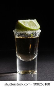 Gold Tequila Shot With Lime Fruits Isolated On White Background