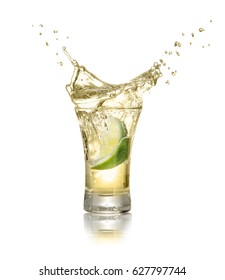 gold tequila shot with splash isolated on white background. Lime is falling in the alcohol drink - Shutterstock ID 627797744