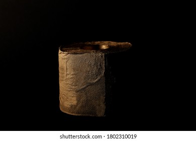 Gold Toilet Paper On A Black Background