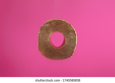 Gold Toilet Paper On A Pink Background