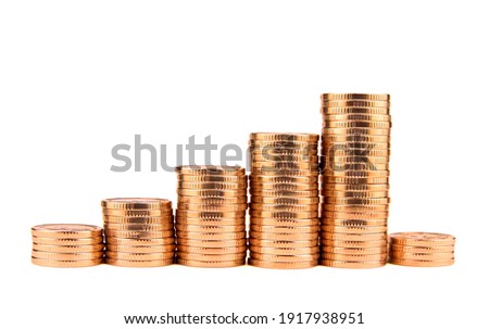 Gold towers made out of gold coins isolated on white