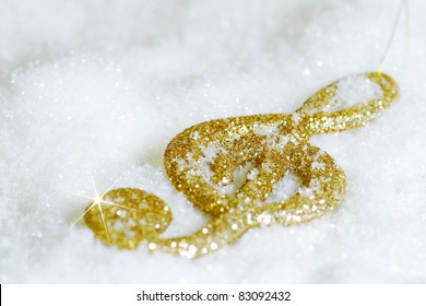 Gold Treble Clef Isolated On White Snow