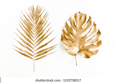 Gold tropical palm leaves Monstera on white background. Flat lay, top view minimal concept. - Shutterstock ID 1192758517