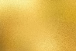 Gold Wall Texture Background. Yellow Shiny Gold Foil Paint On Wall Sheet With Gloss Light Reflection, Vibrant Golden Paper Luxury Wallpaper 
