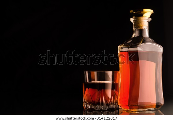 Download Gold Whiskey Bottle Glass On Dark Stock Photo Edit Now 314122817 PSD Mockup Templates
