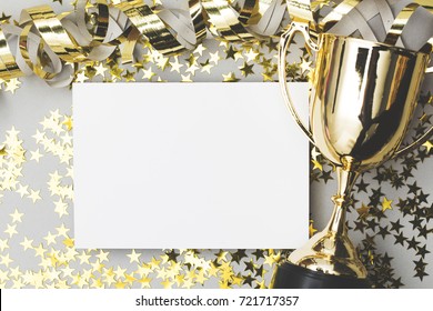 Gold winners trophy with a blank poster label and golden shiny stars
