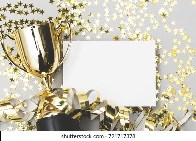 Gold Winners Trophy With A Blank Poster Label And Golden Shiny Stars