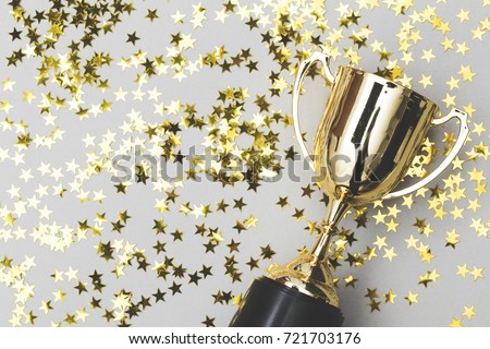 Gold winners trophy with golden shiny stars
