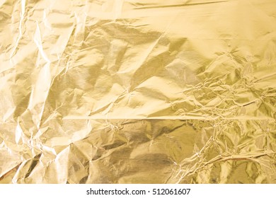 Gold wrinkled paper texture abstract background