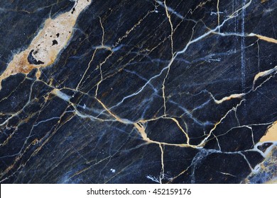 Gold, yellow and white patterned natural structure of dark gray blue marble texture background.