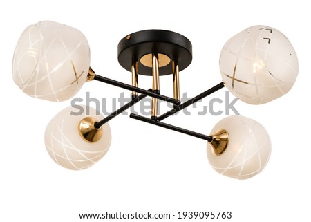 Gold-black four-lamp ceiling lamp with frosted glass shades with geometric patterns in the form of diagonal criss-crossing stripes. Isolated on white background