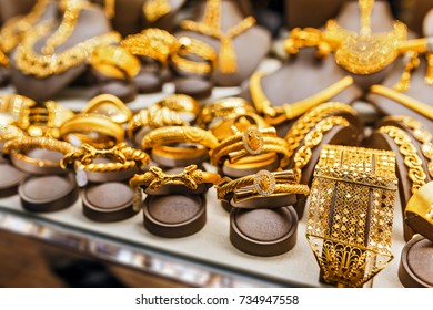 Golden Accessories In The Display Window Of A Jewelery Store