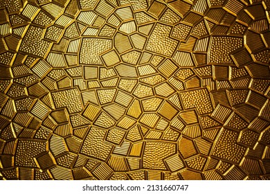 Golden antique background with polygonal texture. Gold plate with a geometric pattern, close-up. - Powered by Shutterstock