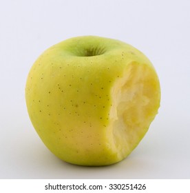 Golden Apple with bite isolated on white background