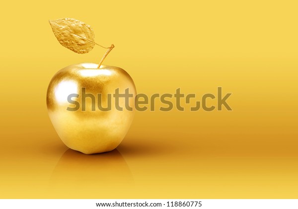 黄色背景上的金苹果 库存照片 立即编辑