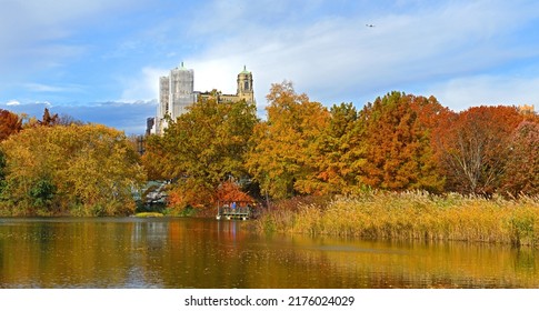 Golden autumn in New York City Central Park. Turtle Pond, originally known as Belvedere Lake, abuts Belvedere Castle, and contains variety of turtles and fish