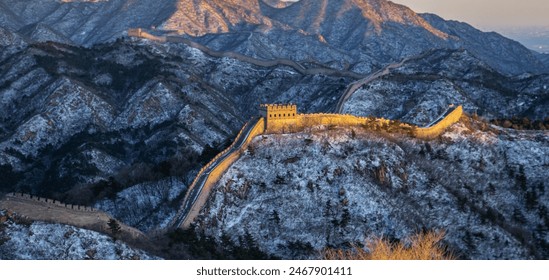 The golden Badaling Great Wall with snow at sunset, Beijing, China - Powered by Shutterstock