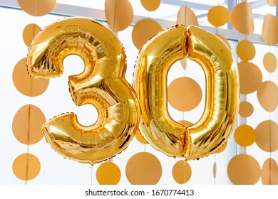 Golden balloons with ribbons - Number 30. Party decoration, anniversary sign for happy holiday, celebration, birthday, carnival, new year. Metallic design balloon.
