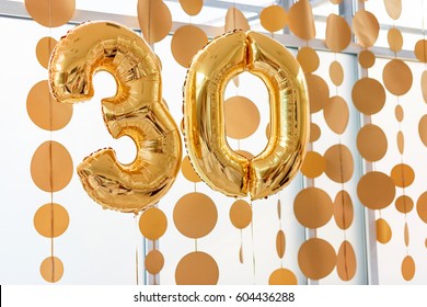 Golden balloons with ribbons - Number 30. Party decoration, anniversary sign for happy holiday, celebration, birthday, carnival, new year. Metallic design balloon.