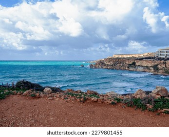 Golden Bay beach  Maltese islands  landscape  windy cloudy weather