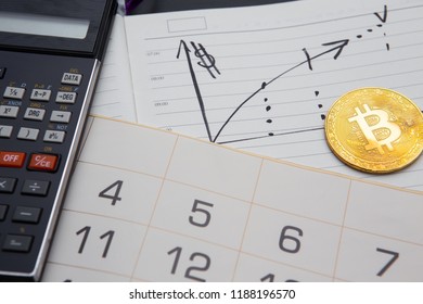 Golden Bitcoin, Calculator, Rising Graph In Diary And Month Calendar. Learning To Invest In Crypto Currency, Income, High Efficiency, Return On Capital, Profitability.