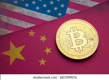 Golden Bitcoin Coin On Top Of Flags Of The United States And Peoples Republic Of China.